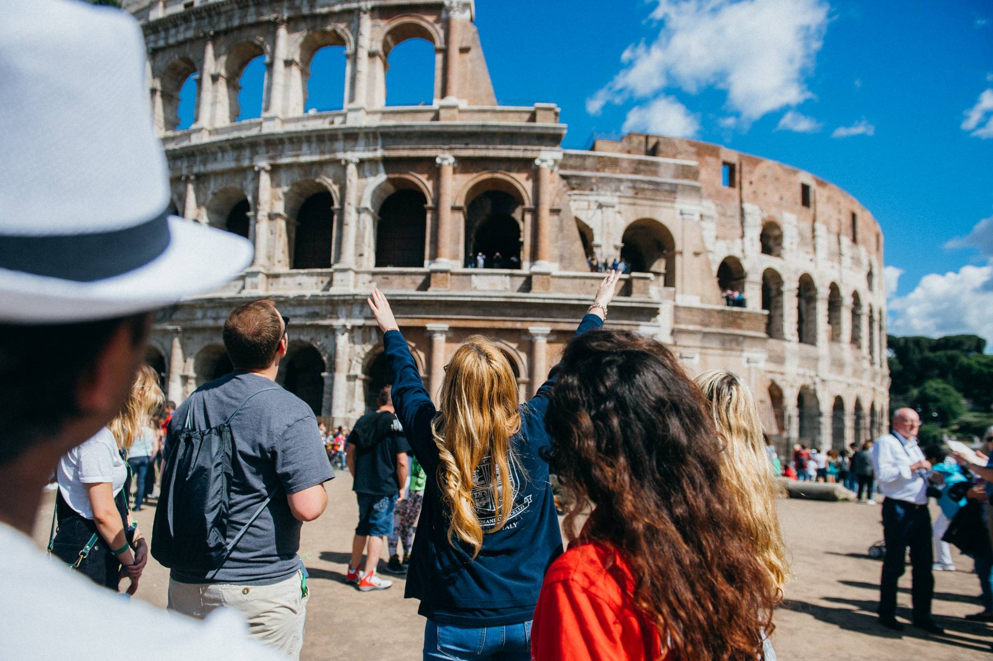 Students in front of the colosseum in Rome, Italy